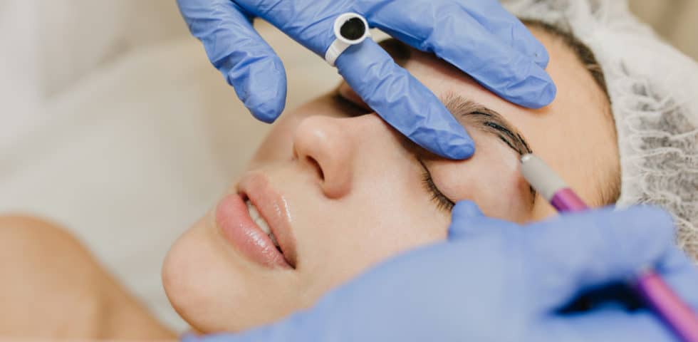 Woman getting botox eyebrow lift injection